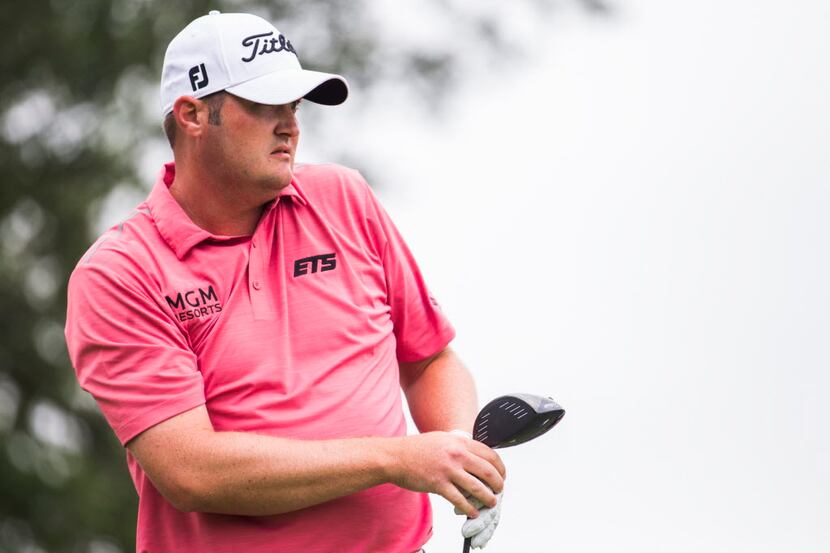 Jason Kokrak looks for his tee shot at the third hole during at the AT&T Byron Nelson on...