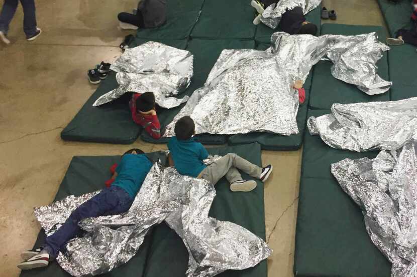 Children taken into custody at the border rest at a facility in McAllen.