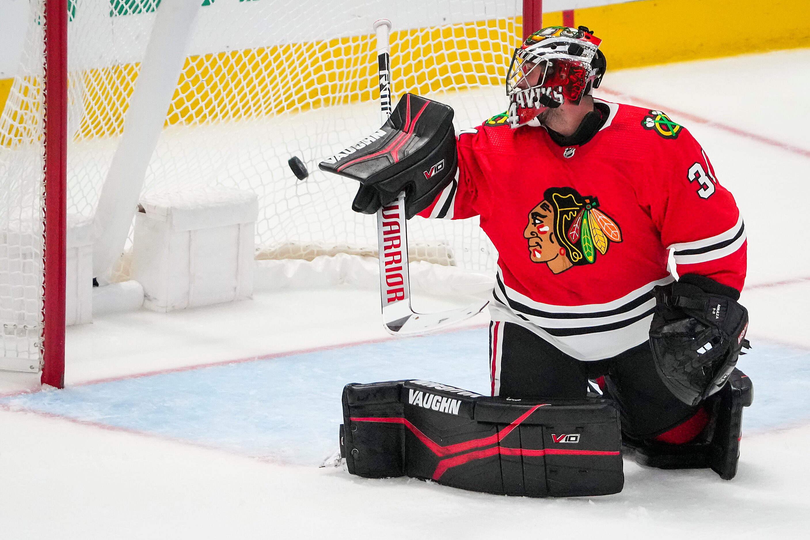 A shot by Dallas Stars left wing Jamie Benn gets past Chicago Blackhawks goaltender Petr...