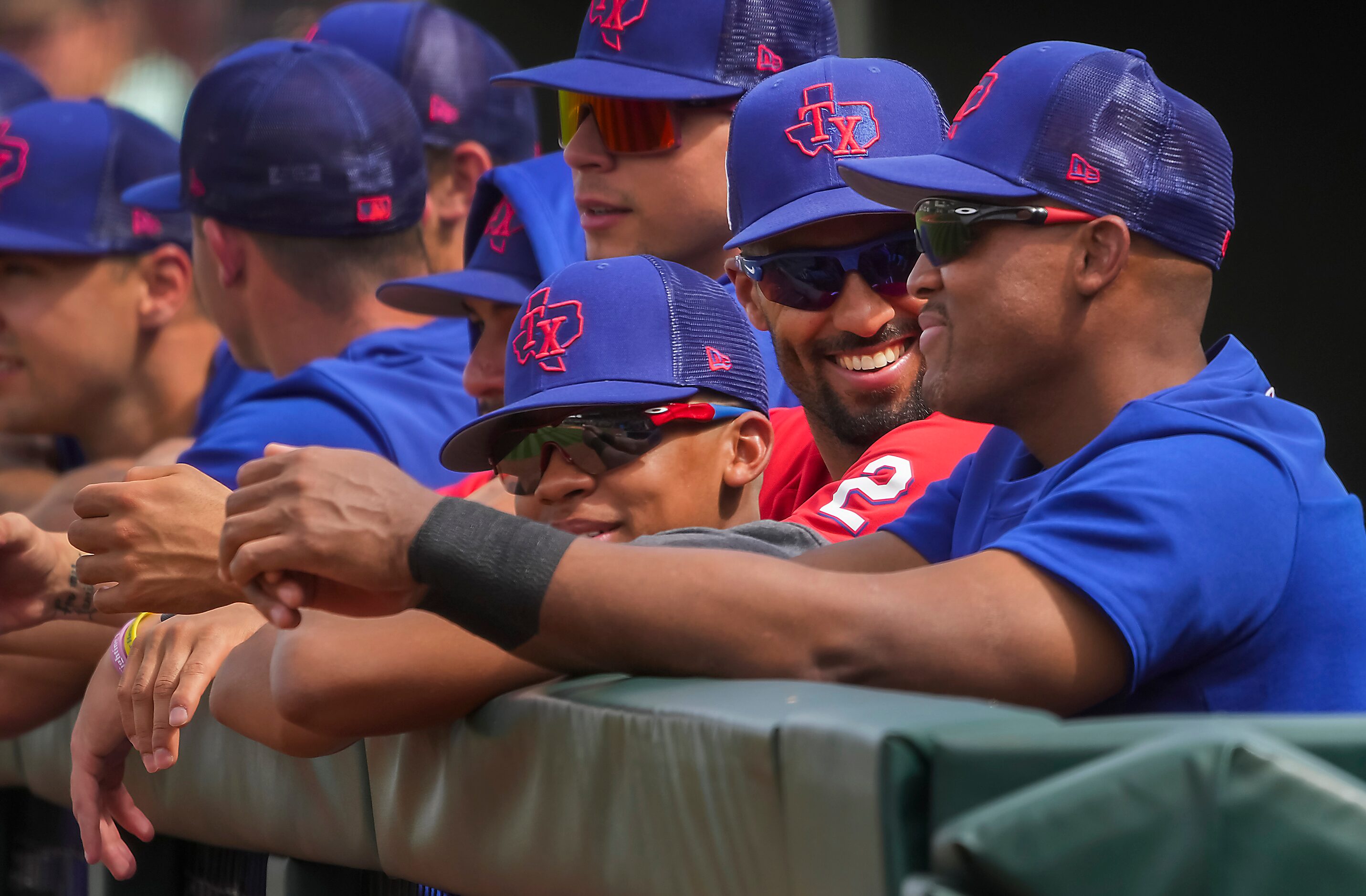 Texas Rangers infielder Marcus Semien (2) laughs with former Rangers third baseman Adrian...