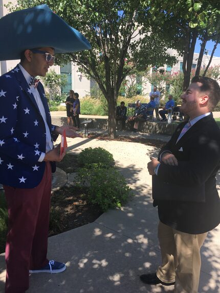 Transgender DISD preschool teacher Johnny Boucher (right) talks to community member Bhavik...