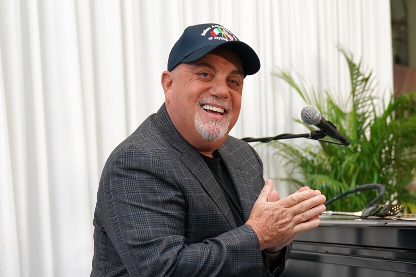 Musician Billy Joel poses at the piano after a July 2018 press conference at Madison Square...