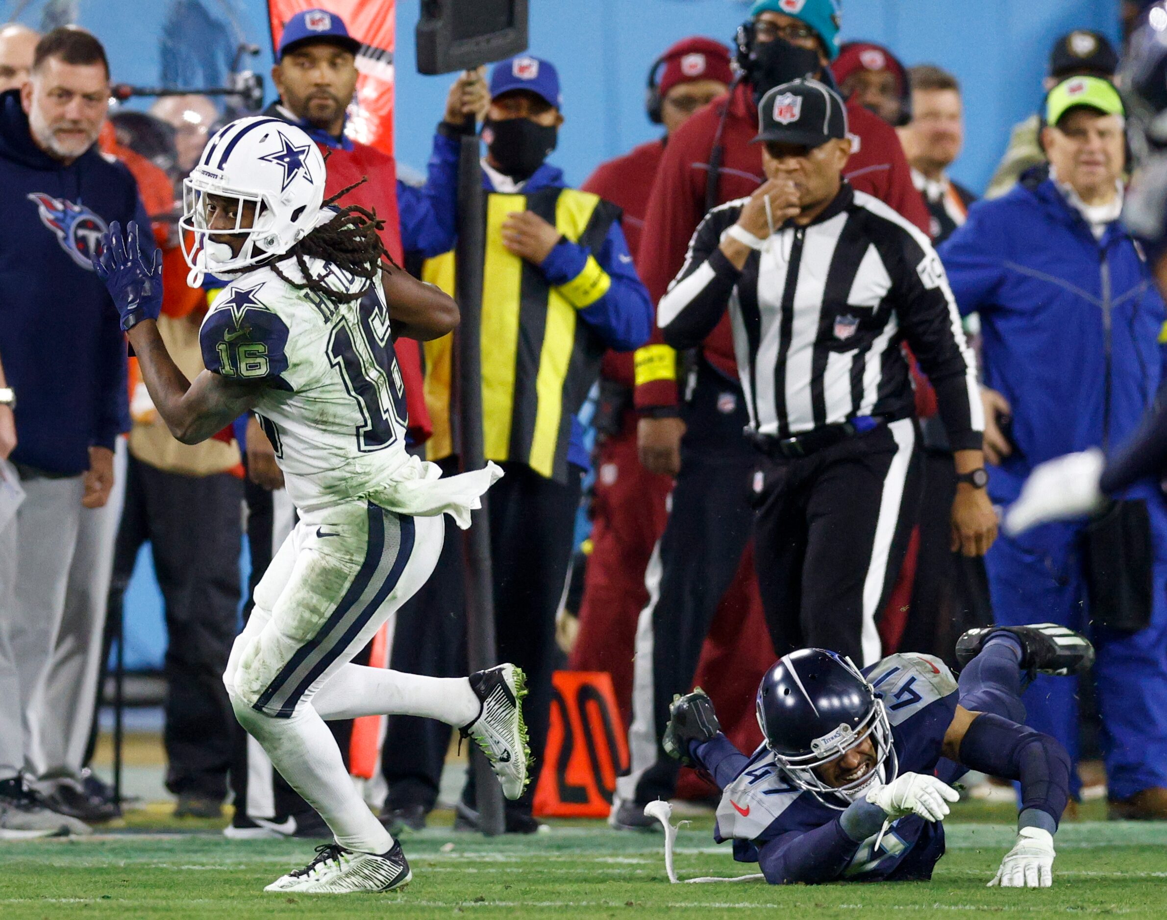 Dallas Cowboys wide receiver T.Y. Hilton (16) slips a tackle from Tennessee Titans safety...