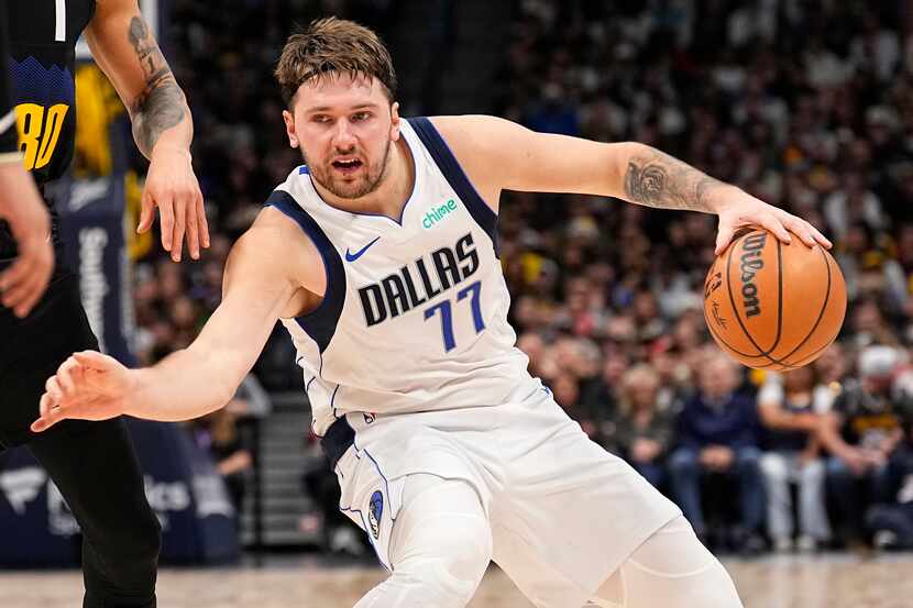 Dallas Mavericks guard Luka Doncic moves against the Denver Nuggets during the second...