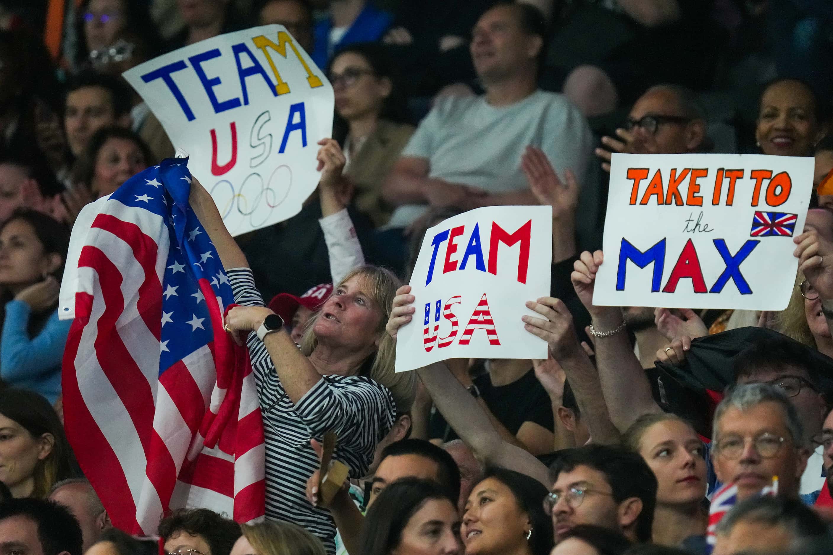 Fans cheer for Team USA during men’s gymnastics qualifying at the 2024 Summer Olympics on...