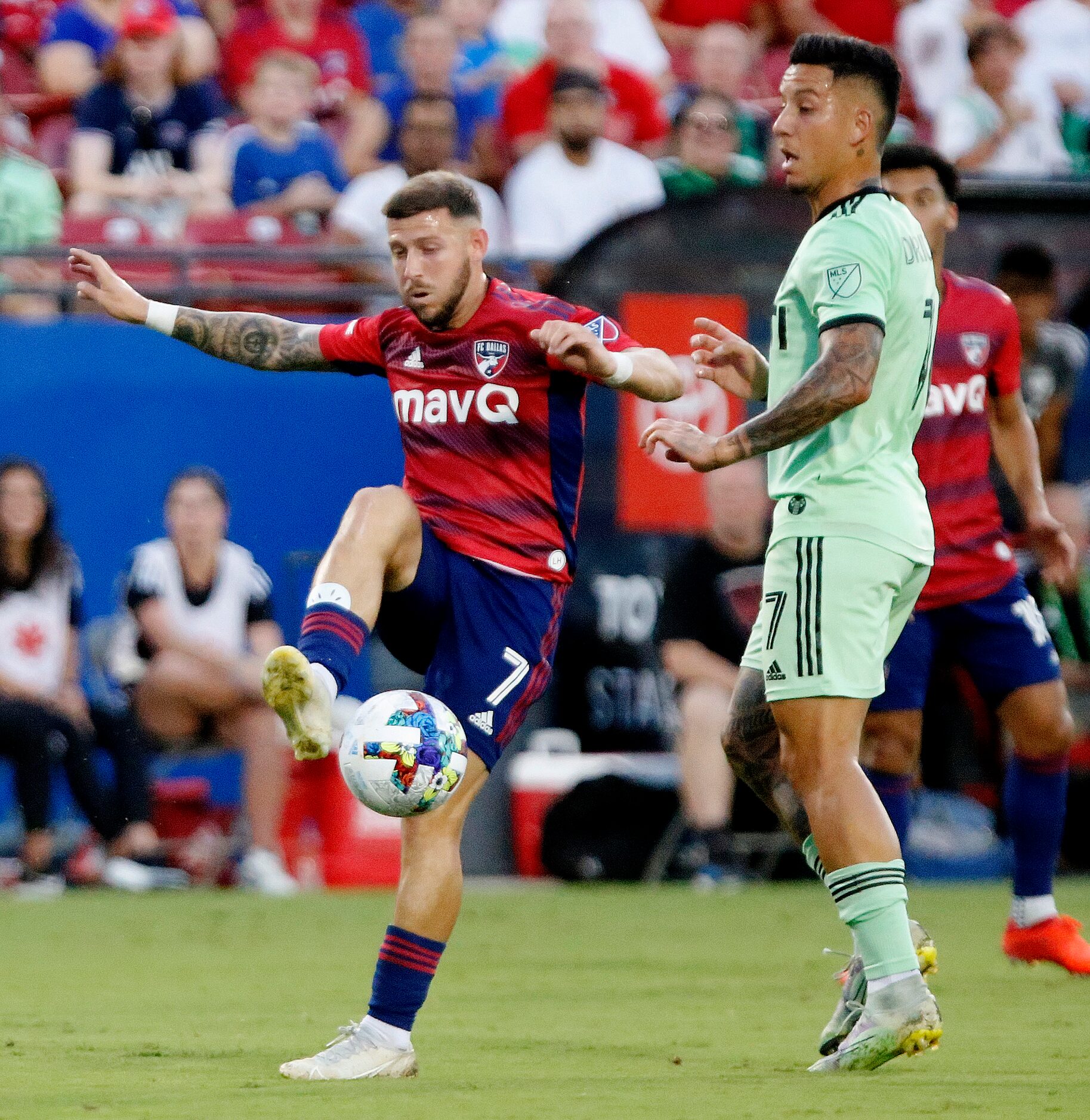 FC Dallas forward Paul Arriola (7) controls the soccer ball in front of Austin FC forward...