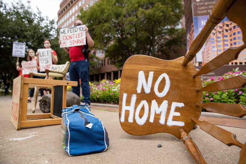 Protestors placed furniture and rallied outside of the office of Texas Sen. John Cornyn "to...