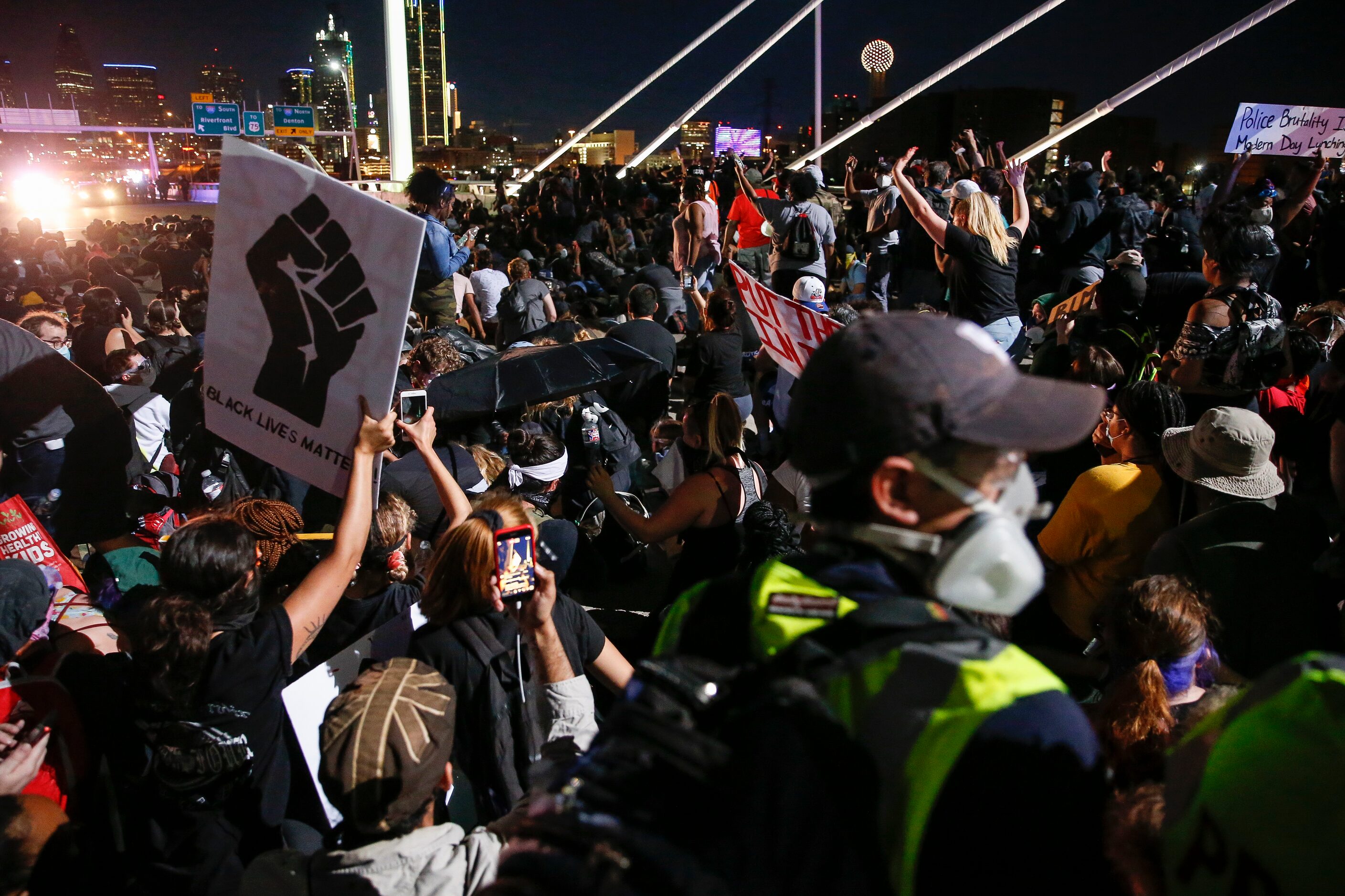 Police surround and detain hundreds of protesters who marched onto the Margaret Hunt Hill...