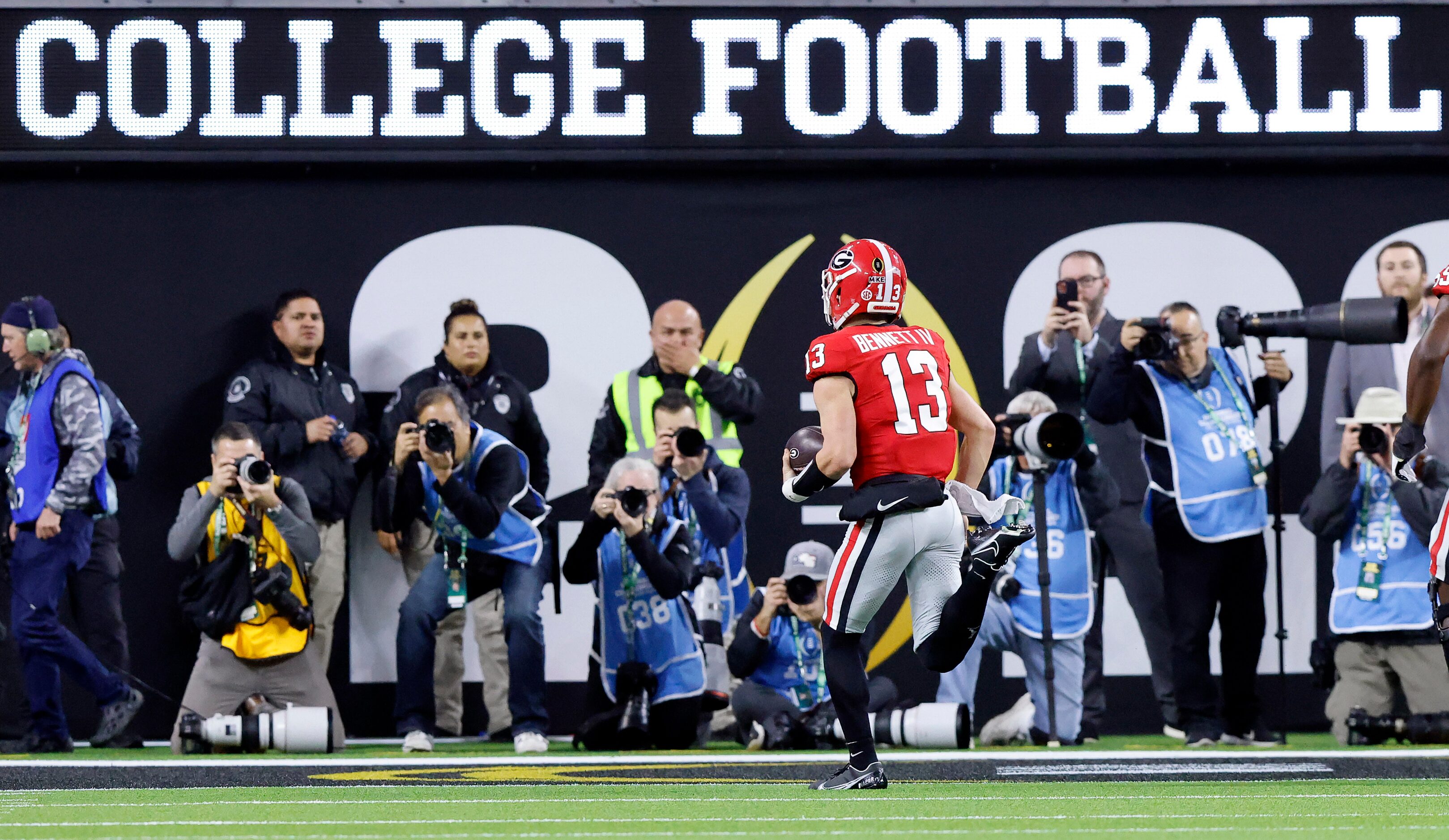 Georgia Bulldogs quarterback Stetson Bennett (13) runs in a second quarter touchdown against...