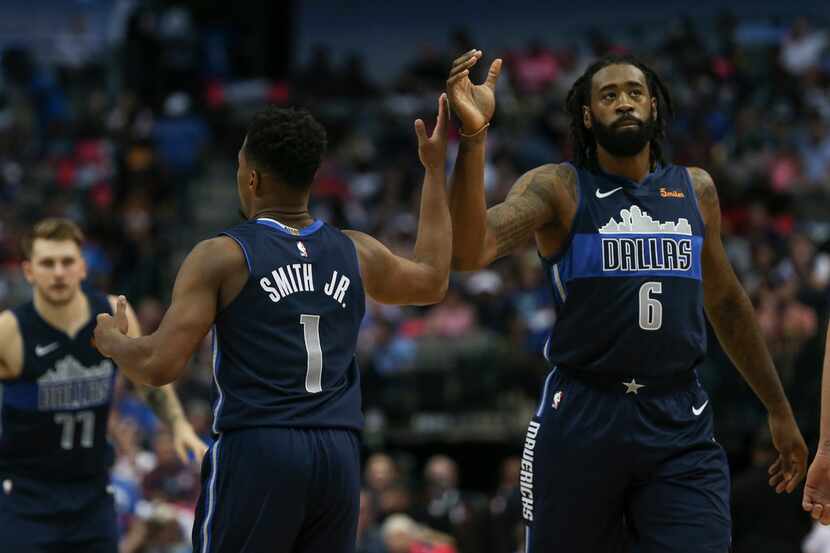 Dallas Mavericks center DeAndre Jordan (6) and guard Dennis Smith Jr. (1) high five during...