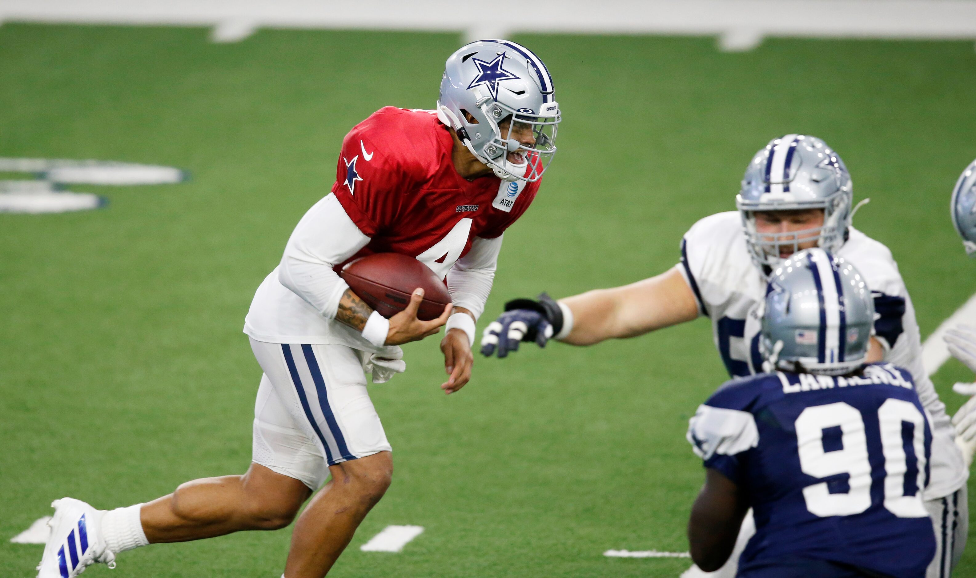 Dallas Cowboys quarterback Dak Prescott (4) runs up the field on a play during training camp...