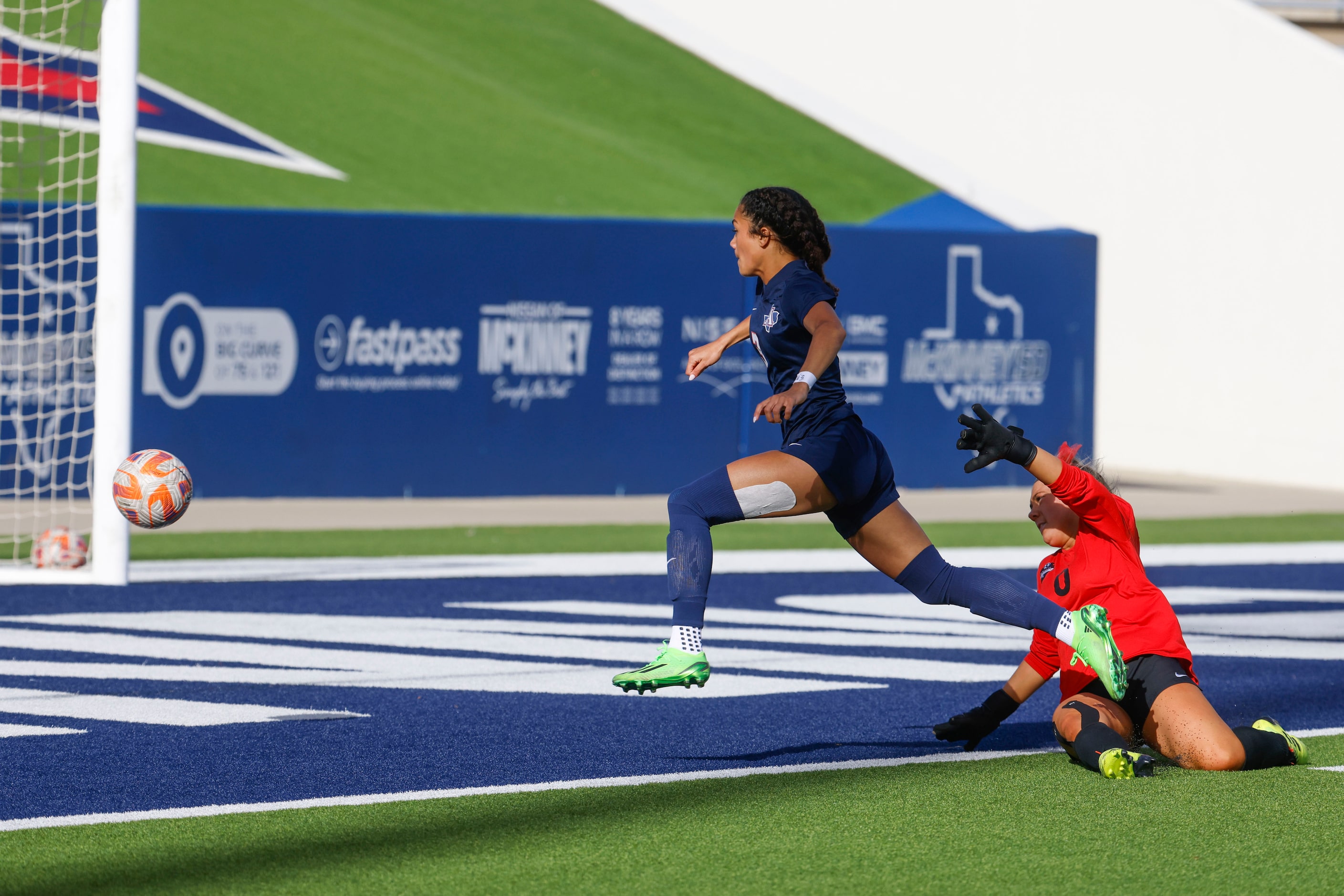 Allen’s Ava McDonald (left) dribbles the ball past Marcus’ goalkeeper Bry Russel during the...