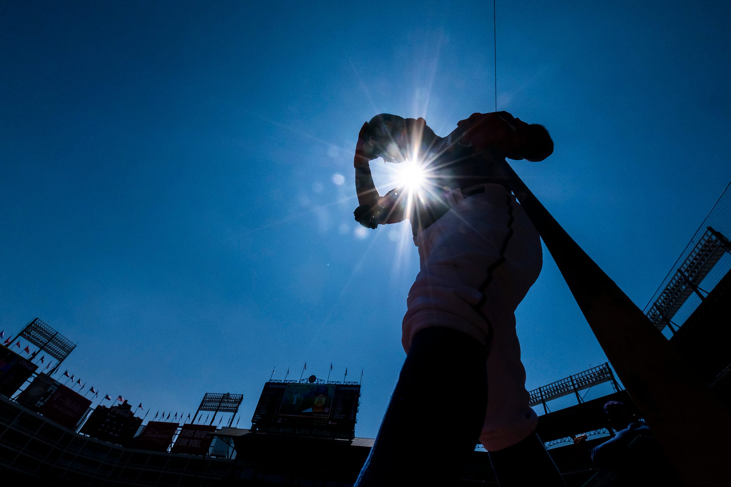 Texas Rangers second baseman Rougned Odor puts on his batting helmet as he heads for the on...