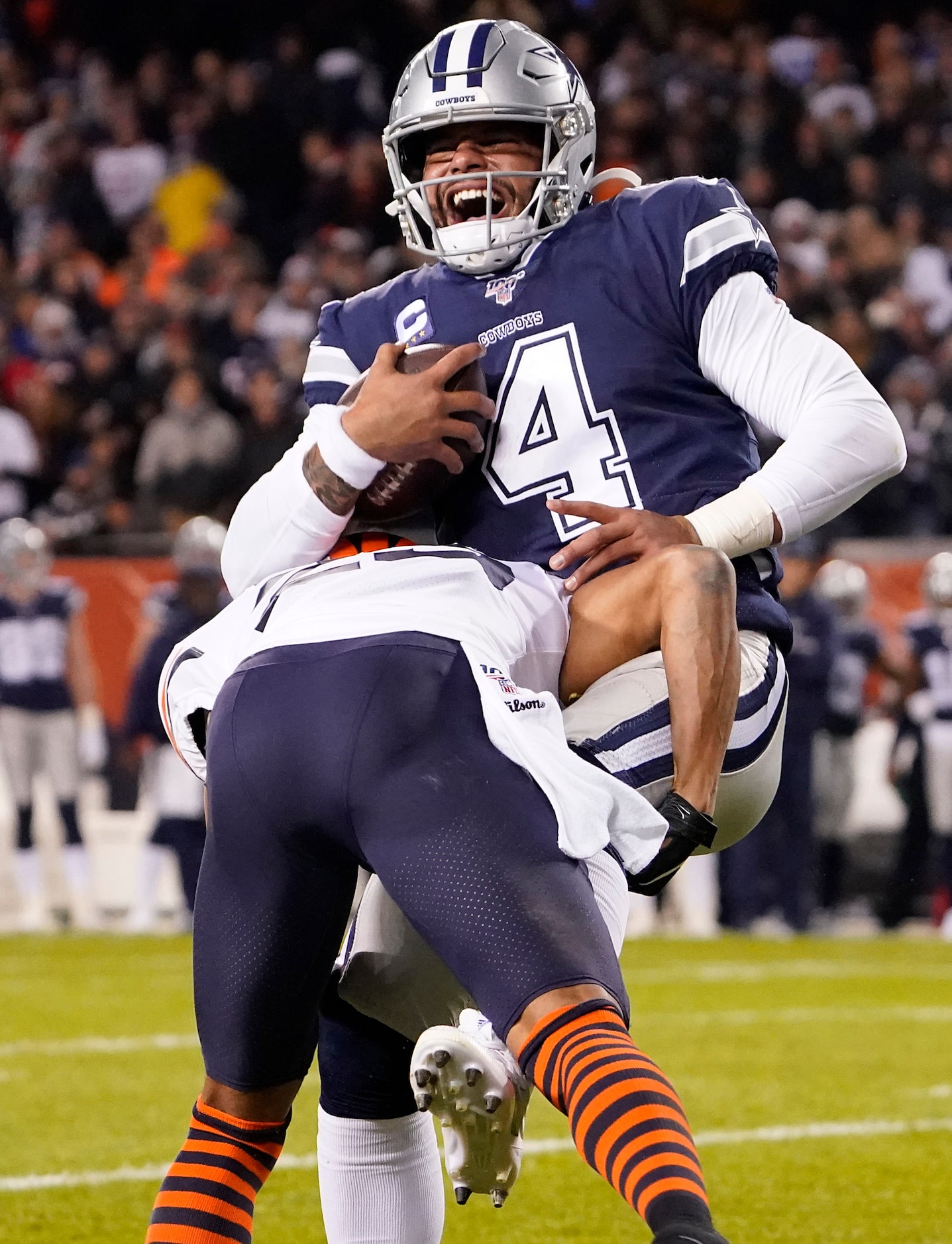 Dallas Cowboys quarterback Dak Prescott (4) is dropped for a loss by Chicago Bears...