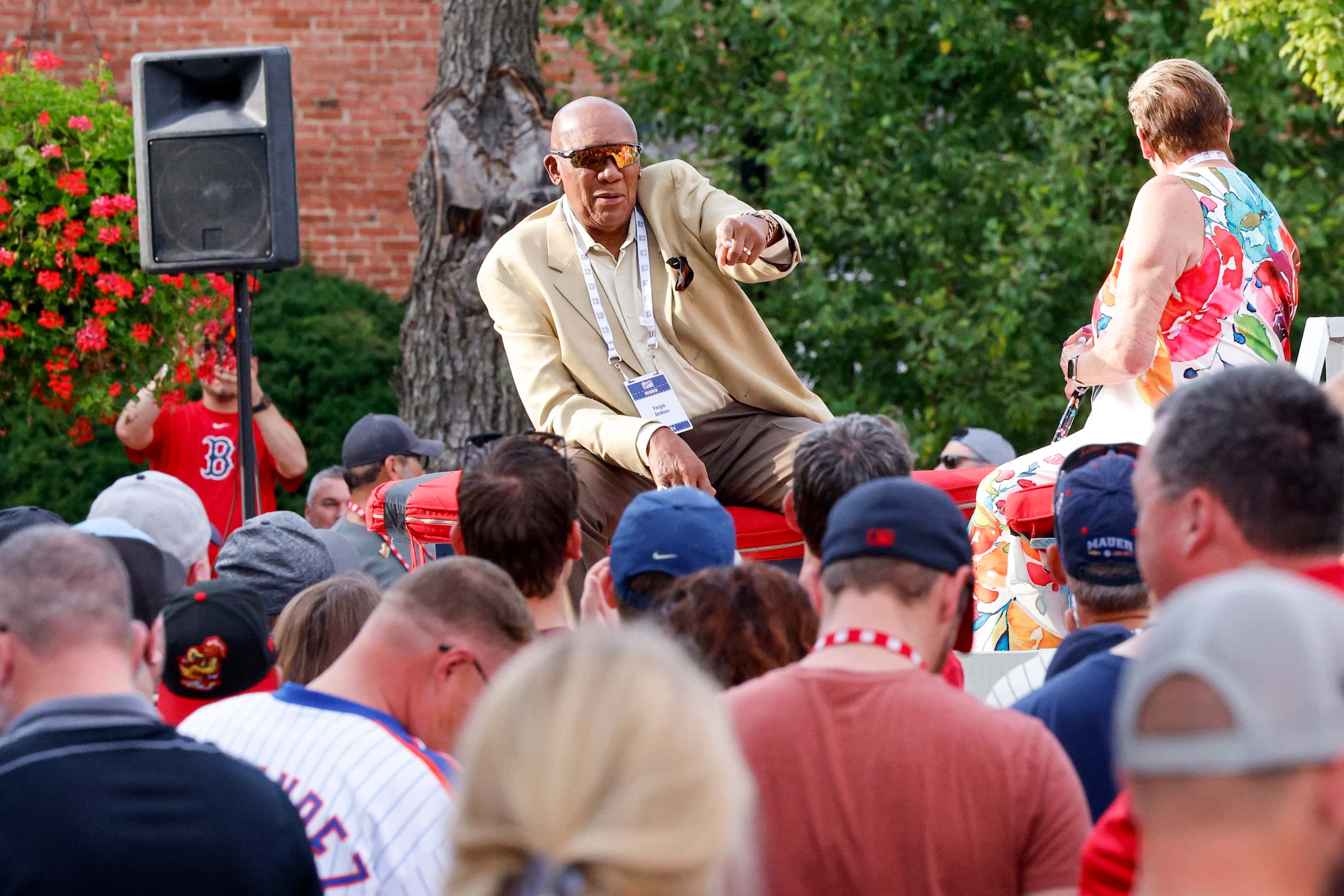 Hall of Famer and former Texas Rangers pitcher Fergie Jenkins points to the crowd during the...