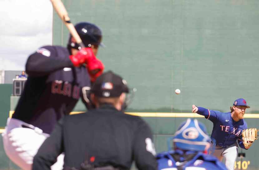 Texas Rangers pitcher Jon Gray delivers during the second inning of a spring training game...