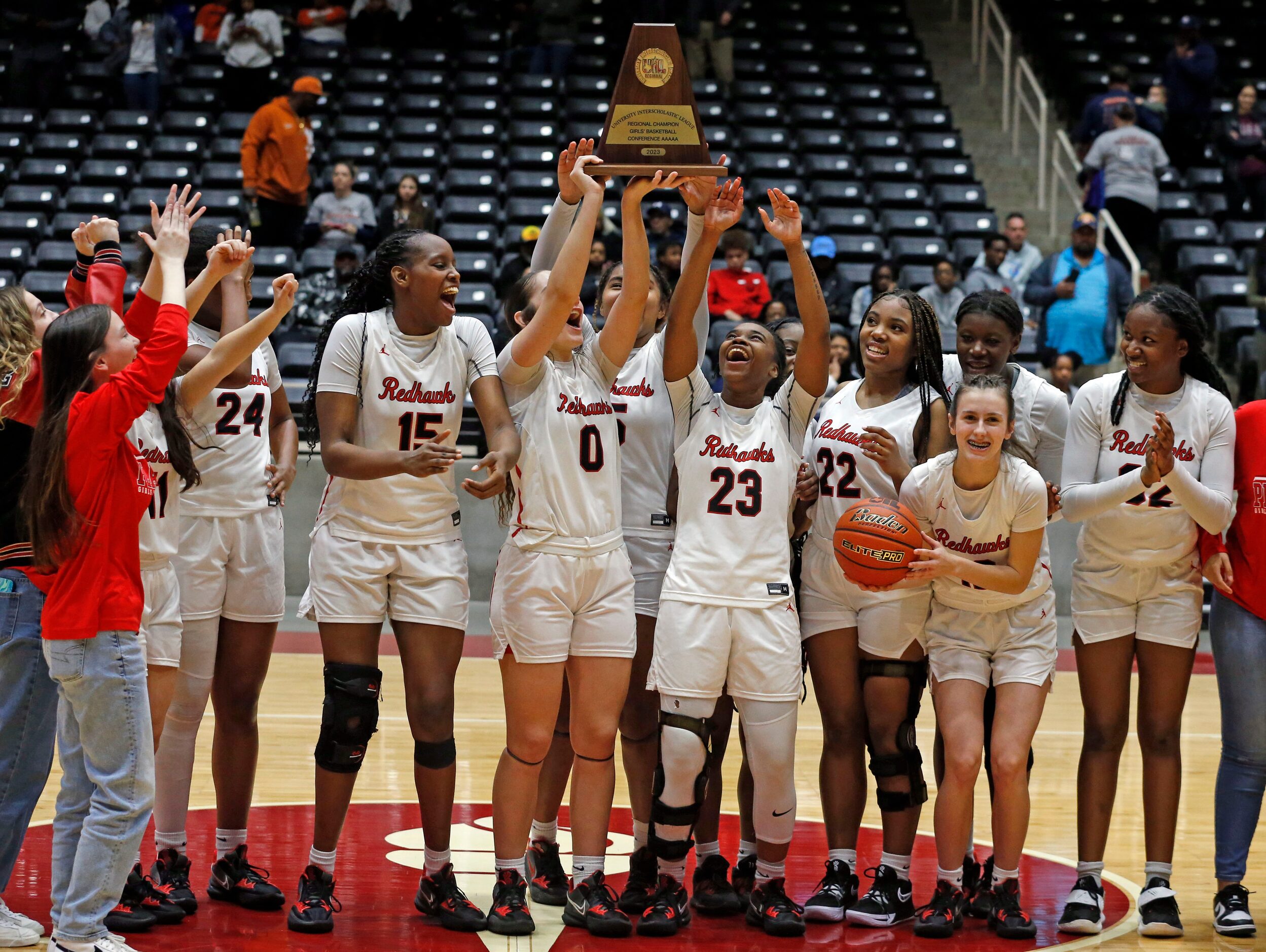 Frisco Liberty High’s G Jezelle Jolie Moreno (0) holds the championship trophy high, and she...