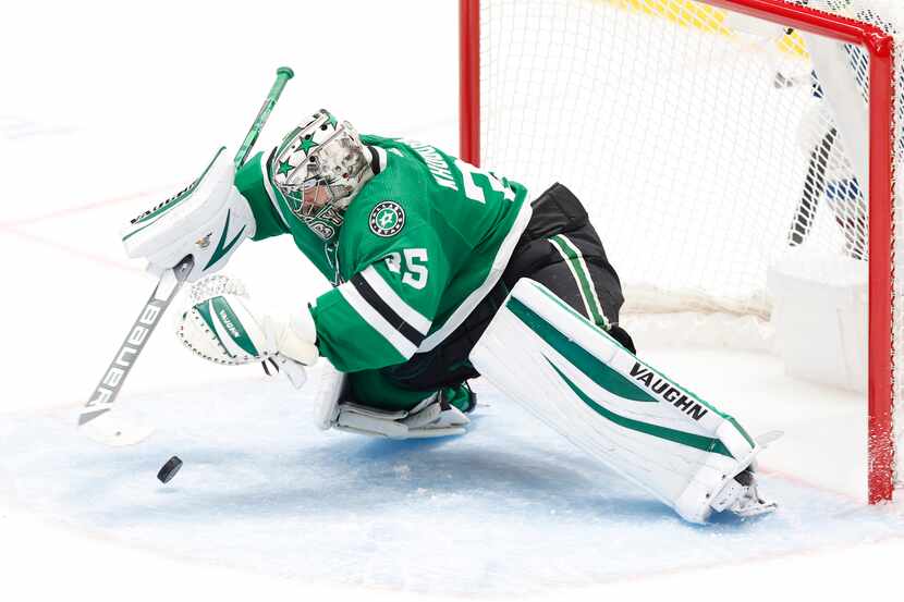 Dallas Stars goaltender Anton Khudobin (35) leaps on the puck after stopping a Colorado...