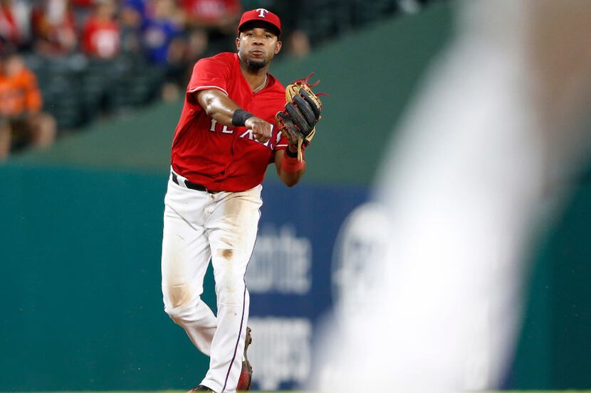Texas Rangers shortstop Elvis Andrus (1) makes a throw to first on a ball hit by Houston...
