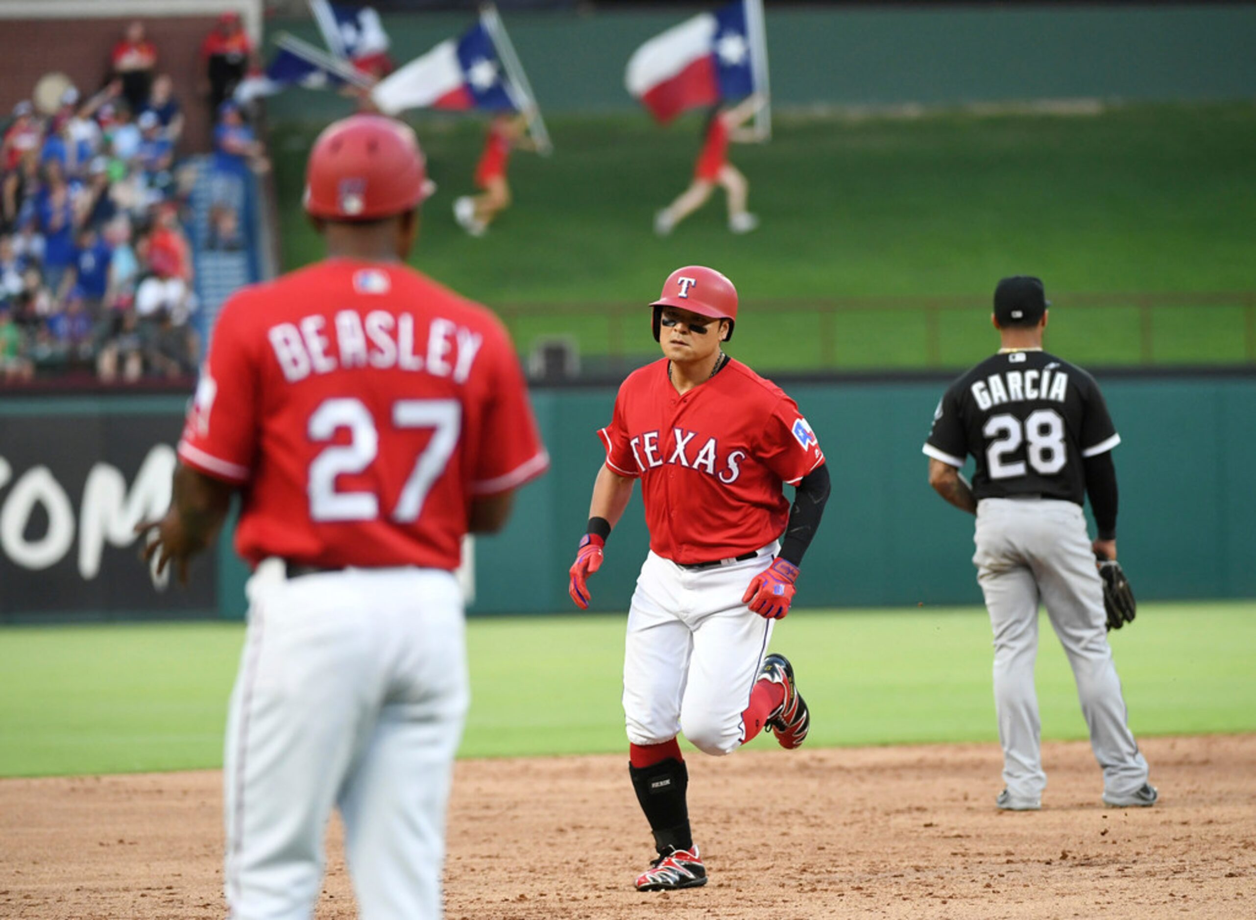 Texas Rangers' Shin-Soo Choo rounds the bases on a two-run home run off of Chicago White Sox...