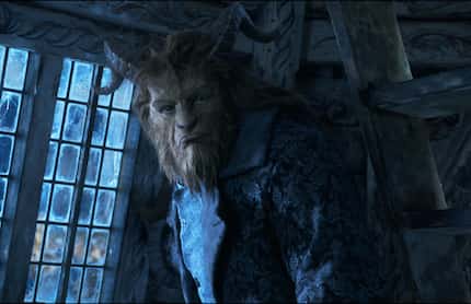 This image released by Disney shows Dan Stevens as The Beast in a live-action adaptation of...