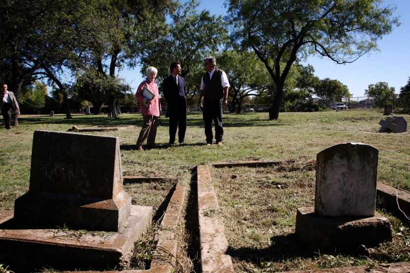 Consul General of France Pierre Grandjouan, center, tours  La Reunion Cemetery with...