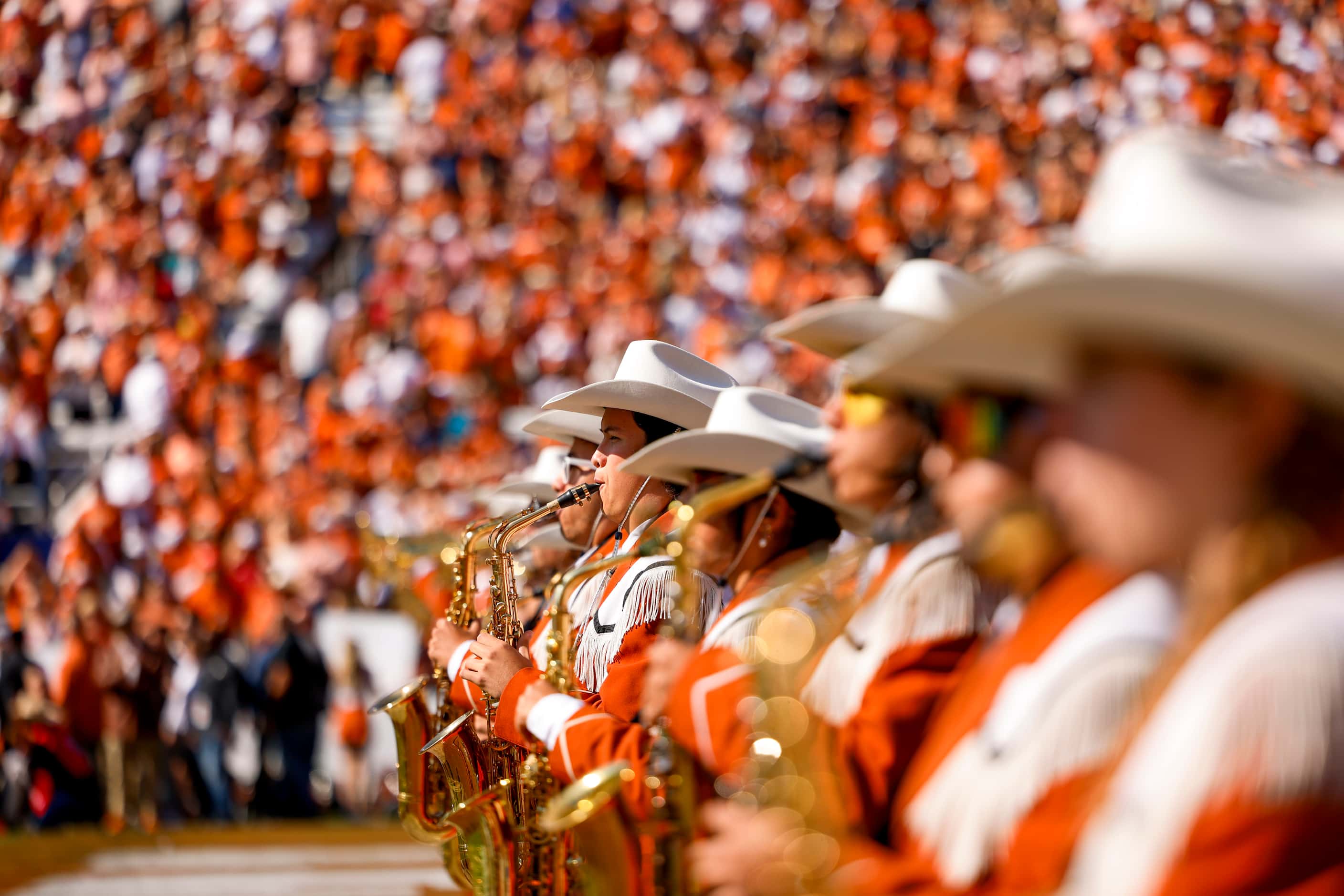 Texas band members perform ahead of the Red River Rivalry against Oklahoma at the Cotton...
