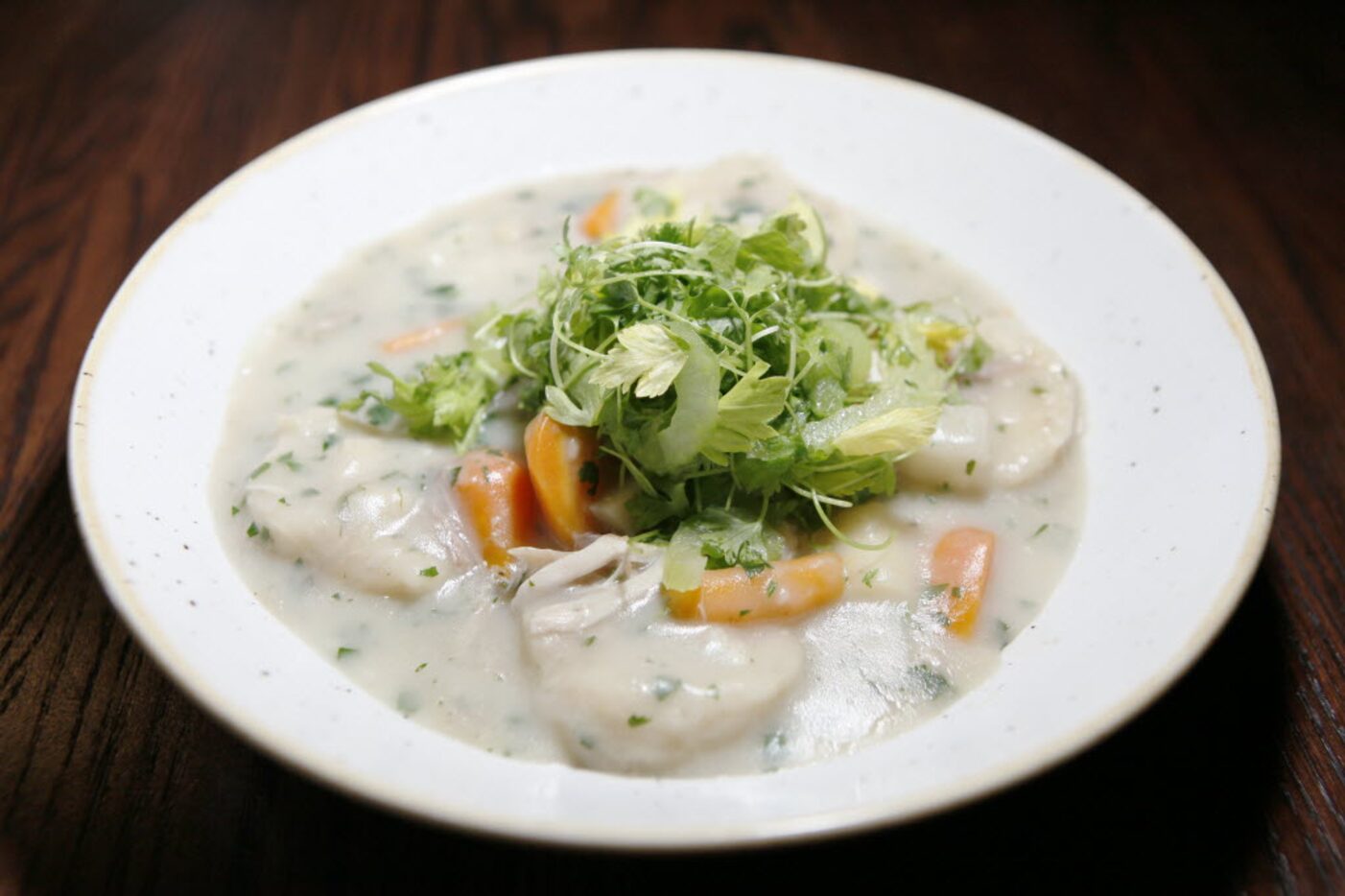 Graham Dodds' chicken and dumplings with thumbelina carrots and micro celery at Wayward Sons