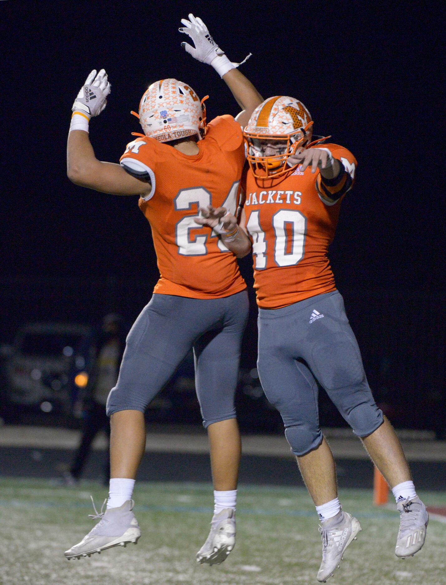Mineola’s Hunter Wright (40) celebrates his touchdown reception with Kobe Kenrick in the...