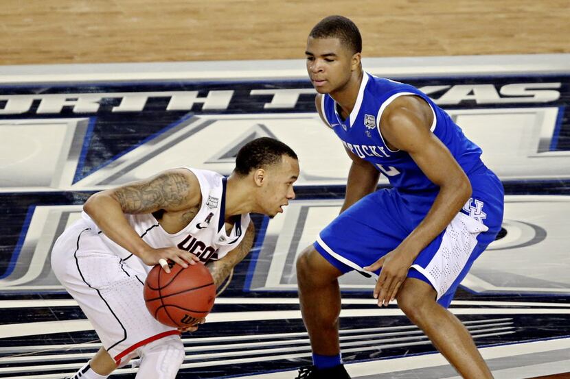 Connecticut Huskies guard Shabazz Napier squares off against Kentucky Wildcats guard Aaron...
