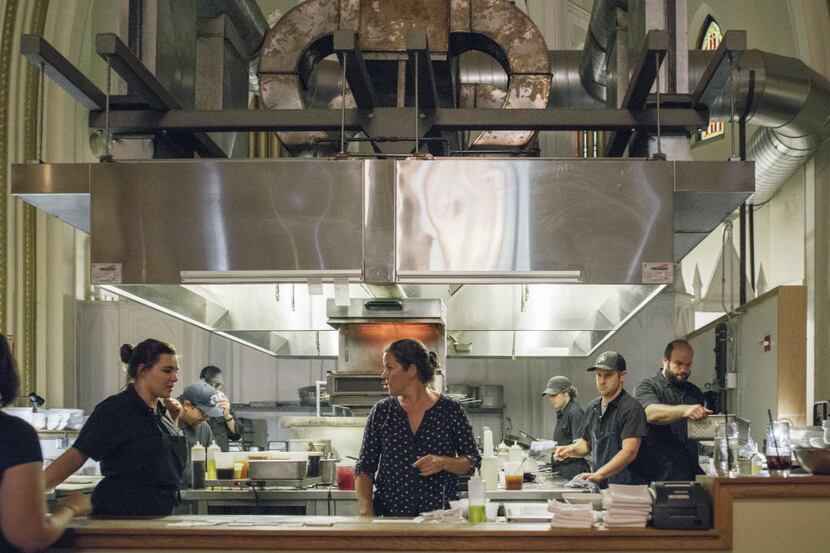 Anne Verrill (center), owner of the restaurant Grace in Portland, Maine, has joined other...
