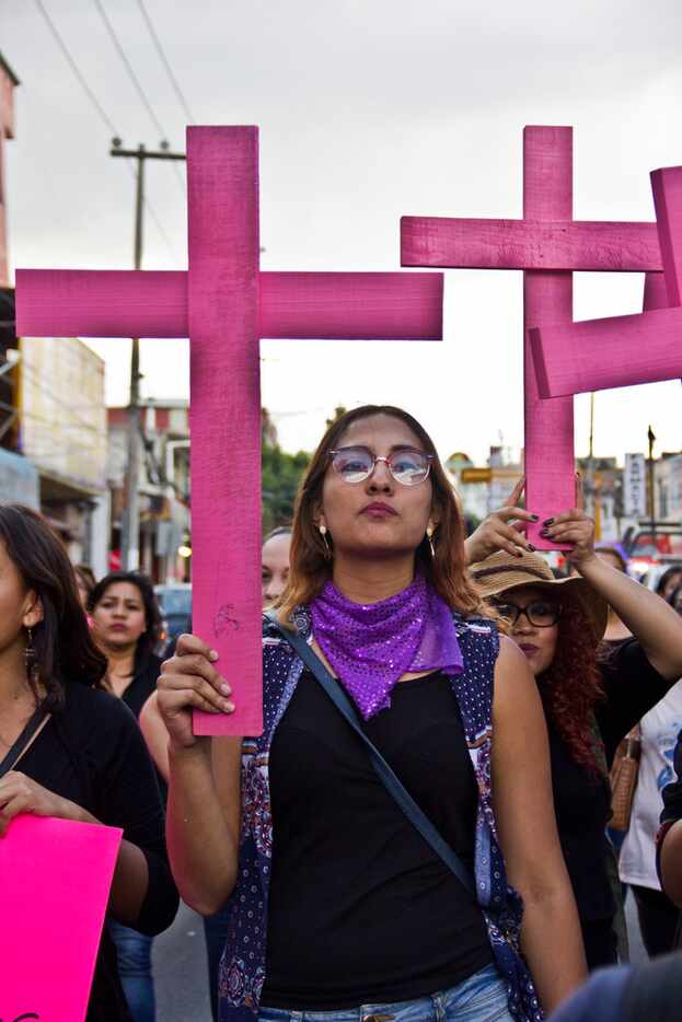 Families and friends march against gender violence on the outskirts of Mexico City in...