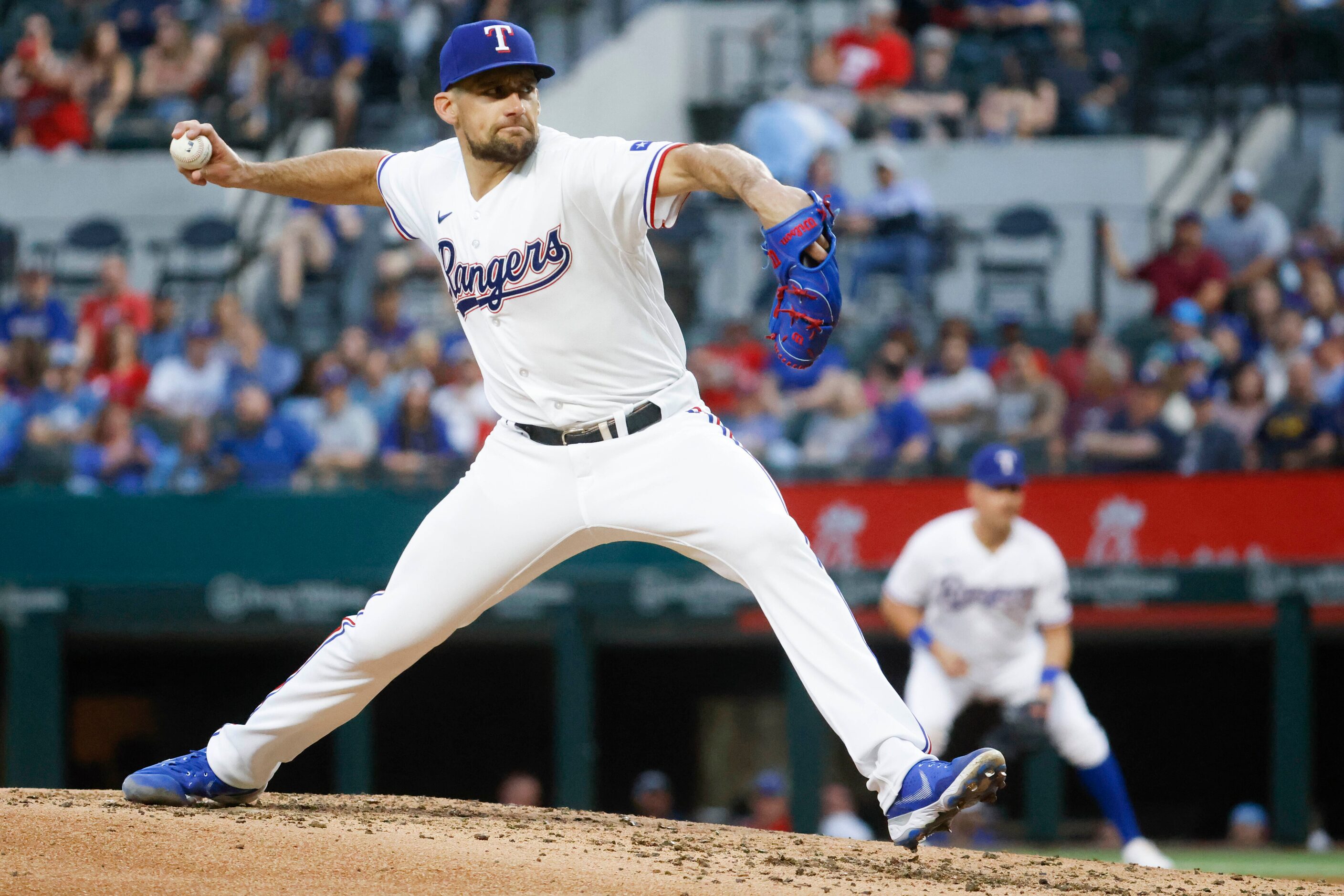 Texas Rangers starting pitcher Nathan Eovaldi (17) throws during the third inning of a...