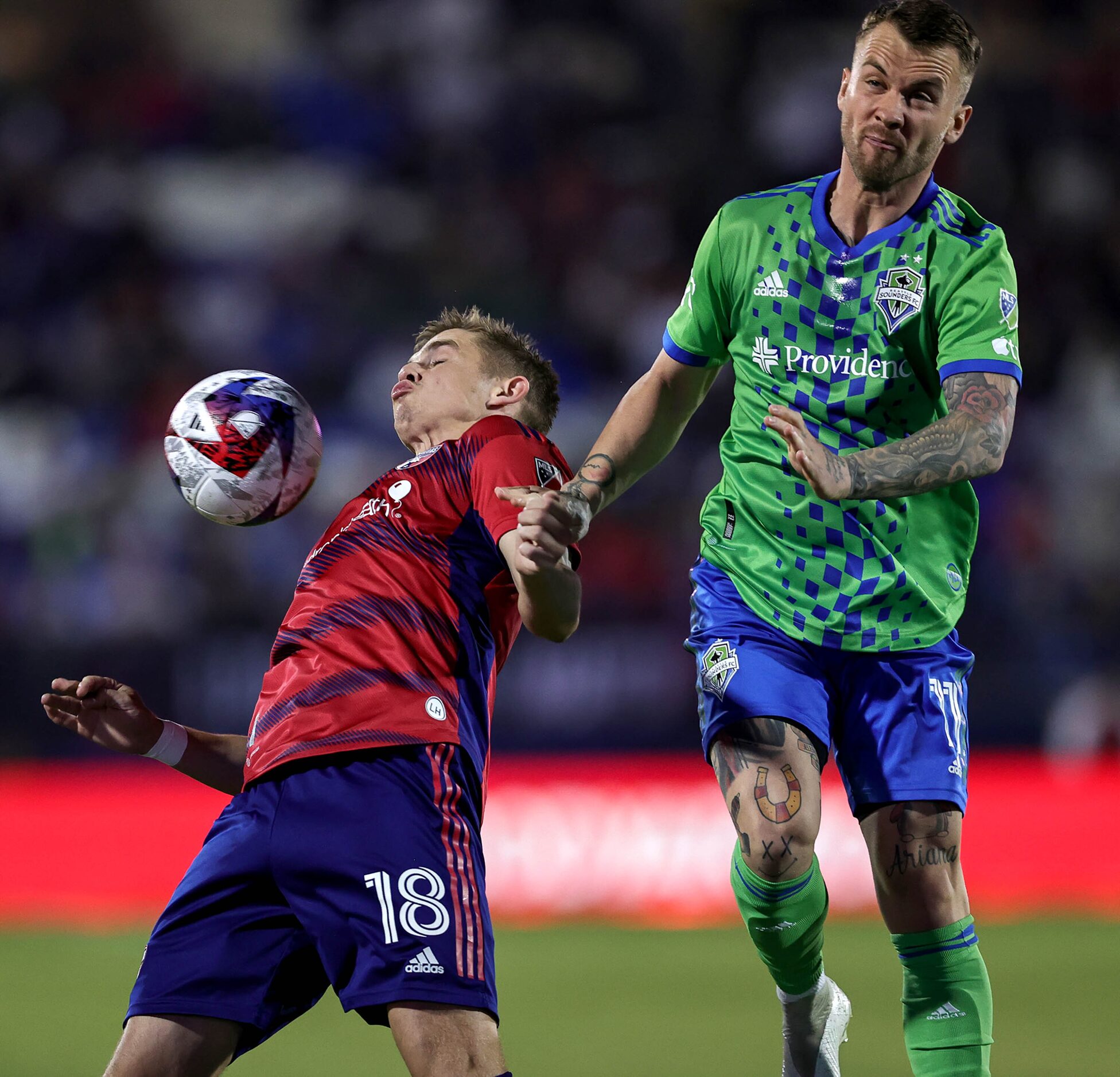 FC Dallas midfielder Liam Fraser (18) tries to control the ball with his chest against...