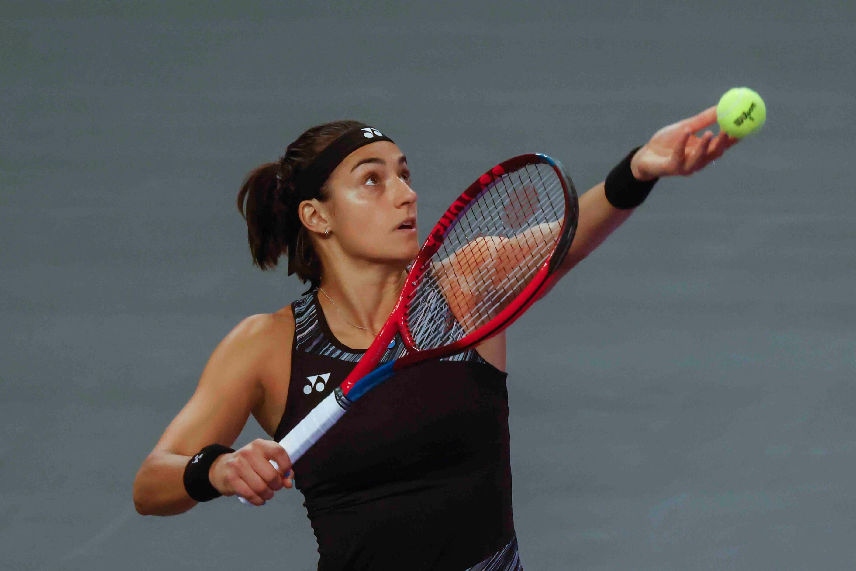 Caroline Garcia of France serves against Coco Gauff of the USA on day two of the WTA Finals...