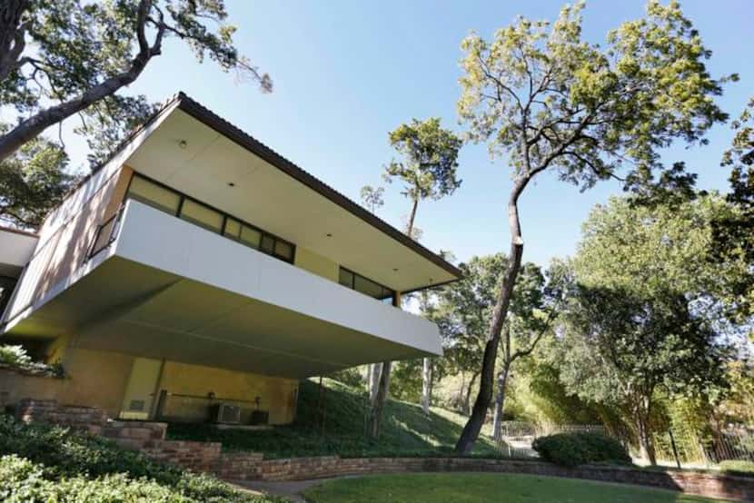 
A view of the house from the backyard shows the cantilevered bedroom wing, a detail Dallas...