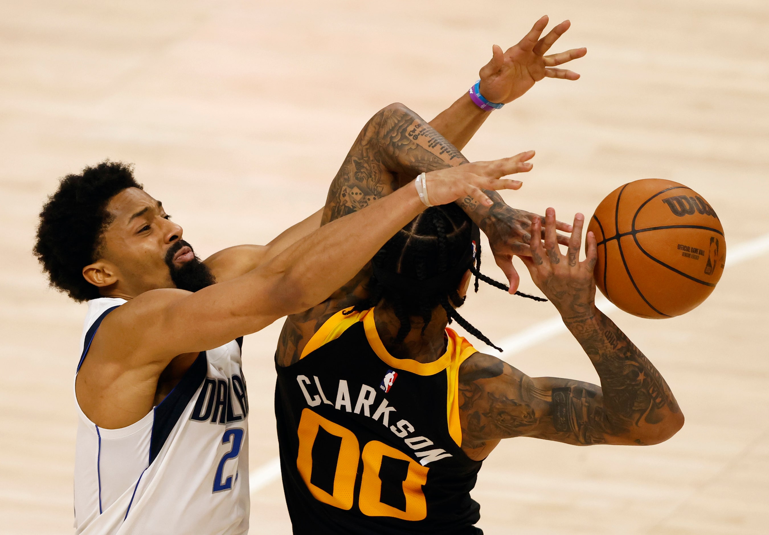 Dallas Mavericks guard Spencer Dinwiddie (26) attempts to knock the ball out of the hands of...