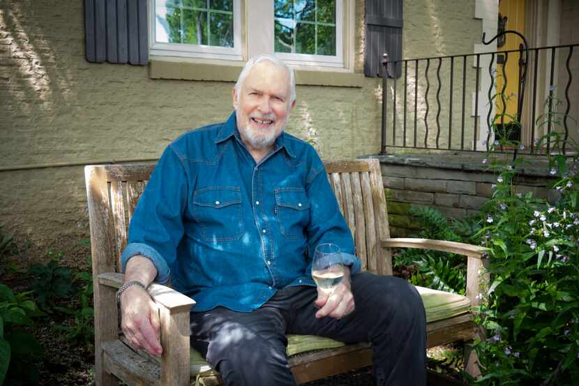 Dr. Keith Marton, sheltering in place at his home in Kessler Park with a glass of Sancerre.