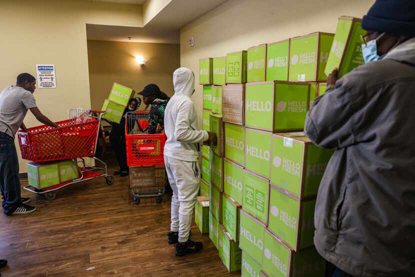 Much-needed food was piling up as volunteers brough boxes of meals into the Lakewest Senior...