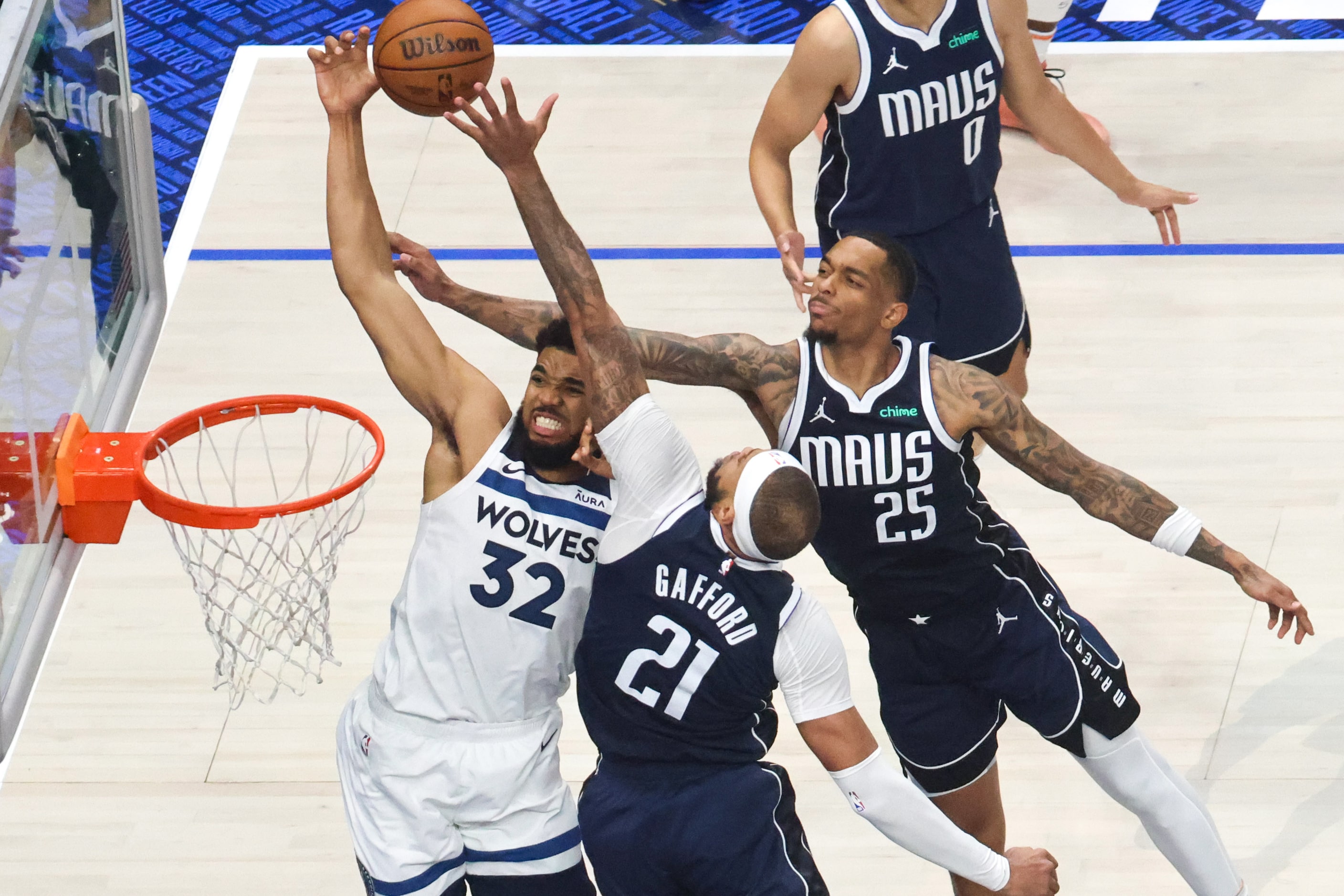 Dallas Mavericks center Daniel Gafford (center) block a shot by Minnesota Timberwolves...