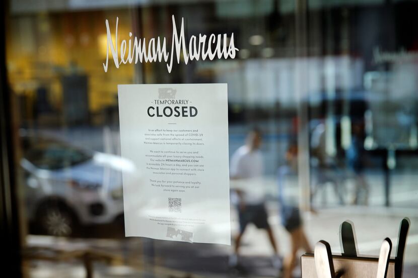 A closed sign appears on the door of Neiman Marcus' flagship store in downtown Dallas,...