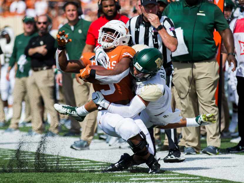 Texas Longhorns wide receiver Collin Johnson (9) is tackled by Baylor Bears safety Blake...