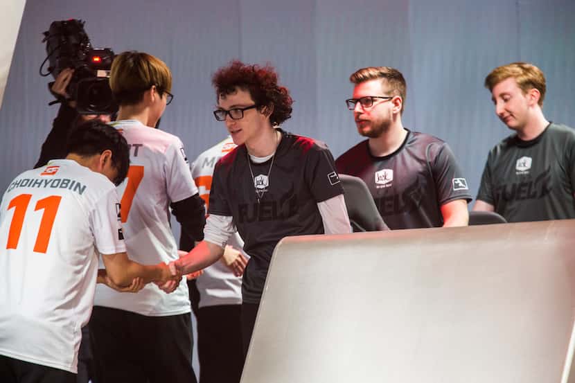 Dallas Fuel players shake hands with San Francisco Shock players after the Fuel lost 4-0 in...