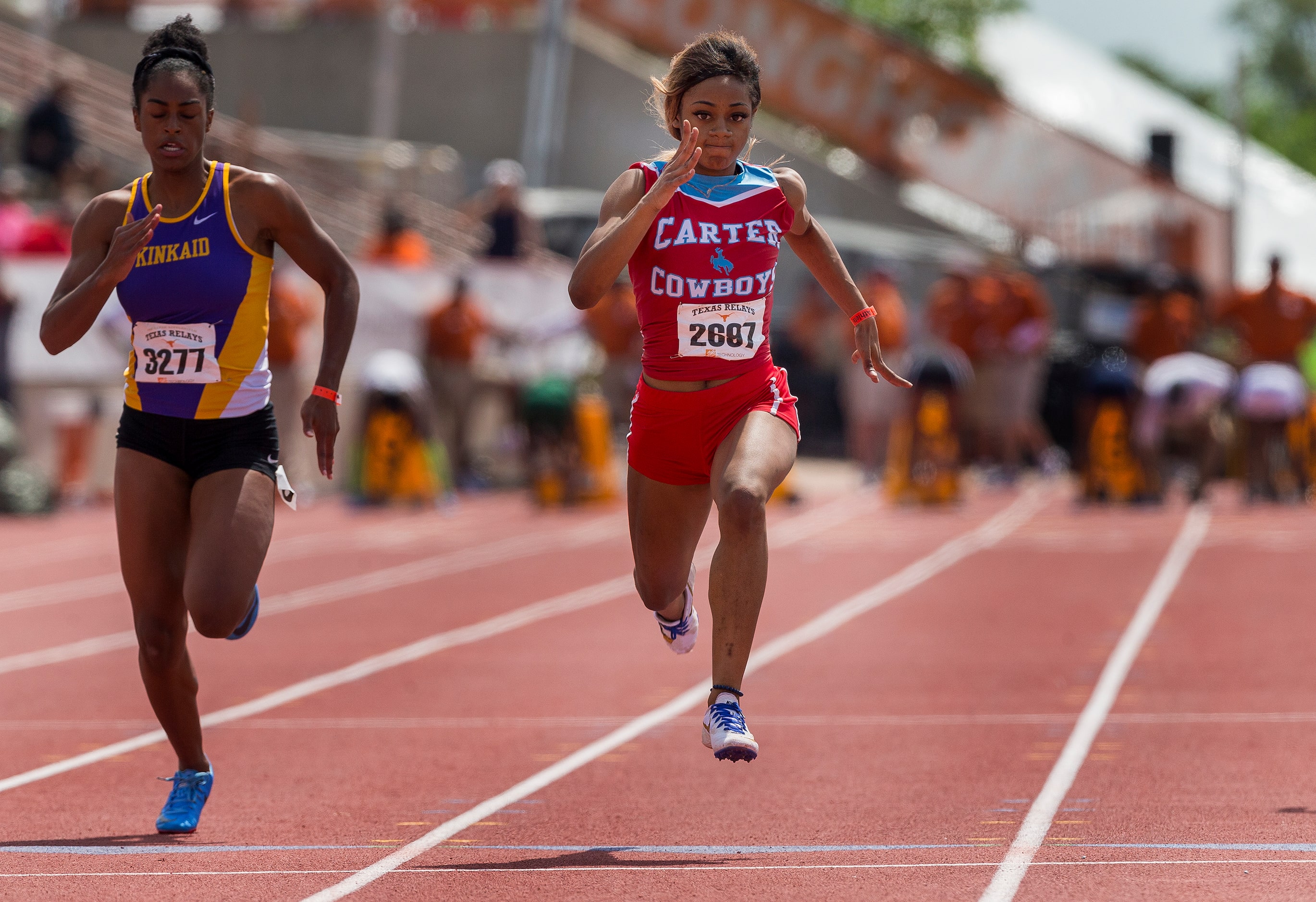 Dallas Carter's Sha'Carri Richardson (2697) passes Kinkaid's Kennedy Gamble (3277) to finish...