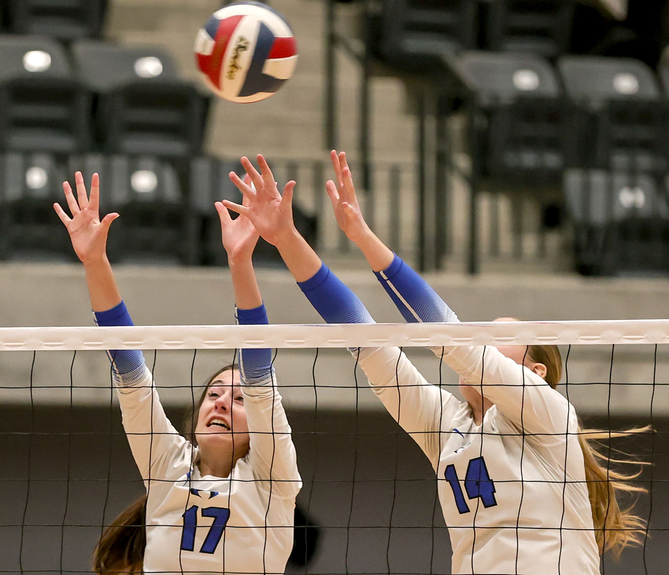 Hebron's Kamryn Mullican (17) and Haley Kerstetter (14) try for a block against Southlake...