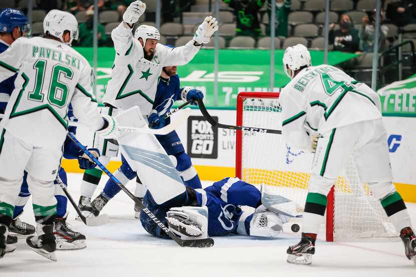 Dallas Stars defenseman Miro Heiskanen (4) scores during the second period of an NHL hockey...