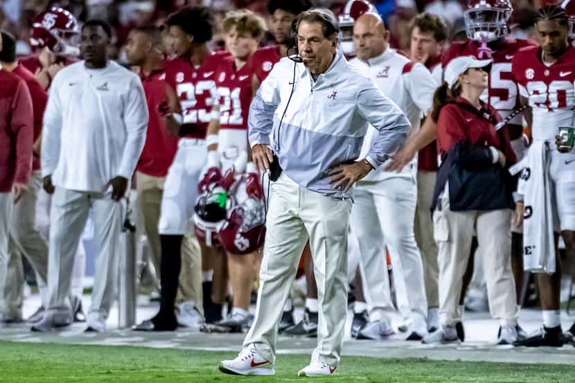 Alabama coach Nick Saban stands near the sideline during the first half of the team's NCAA...