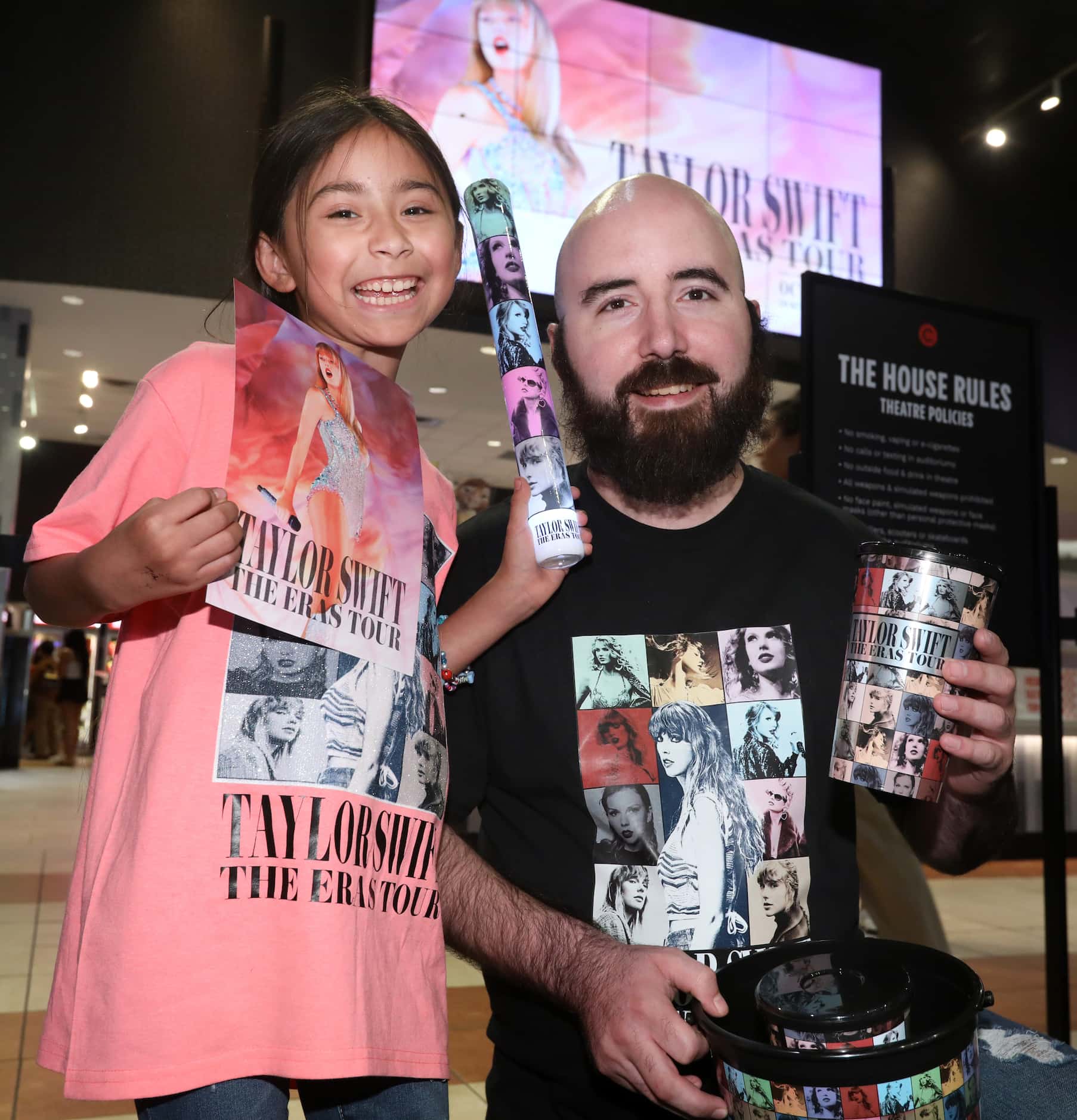 Mila Moreno, 8, and Aaron Moreno prepare to watch Taylor Swift's movie at Cinemark West...