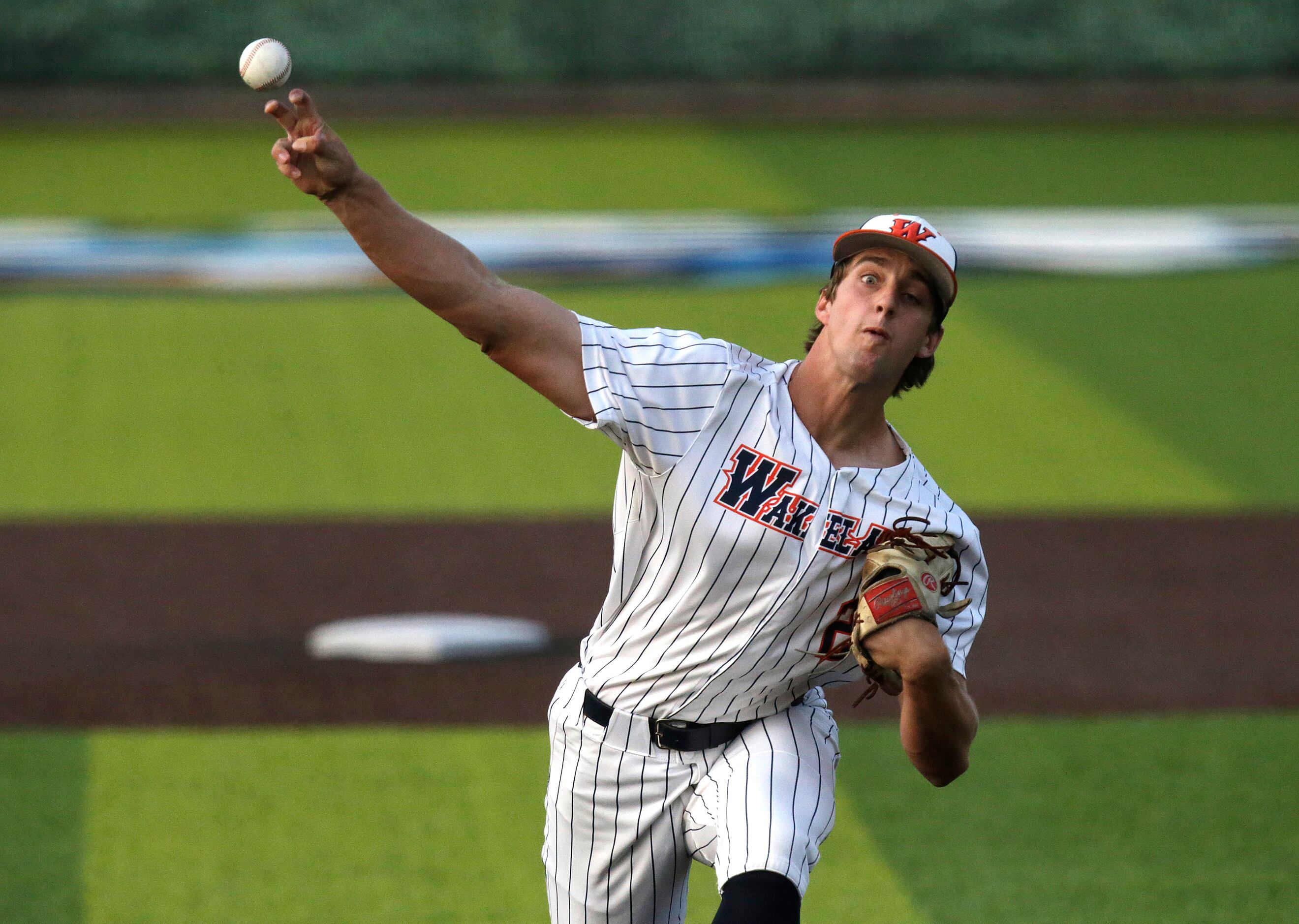 Wakeland High School pitcher Carson Priebe (22) delivers a pitch in the first inning as...