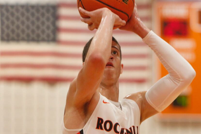 Rockwall guard Samuell Williamson (10) eyes the basket during the first half as he sinks a...
